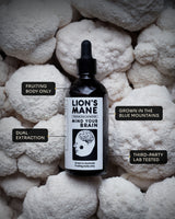 MindRise Lion's Mane Extract bottle on a bed of fresh Lion's Mane mushrooms